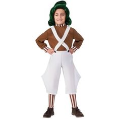 a child wearing a costume with green hair and suspenders standing in front of a white background