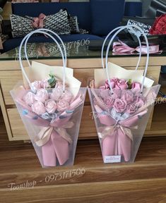 two clear bags with pink roses in them