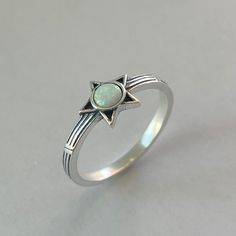 Sterling Silver White Lab Opal Star Ring, Silver Ring, Opal Ring, Star Ring, Sky Ring, Boho Ring, Statement Ring, Promise Ring, Friendship Ring, Anniversary, 925 Stamped *  Perfect gift idea for any occasion: birthday, anniversary, engagement, graduation, bridesmaid, Mother's Day, Valentine's Day, Christmas, promise. *  Your purchase includes a gift box. Let us know if this is a gift and we can ship directly to the recipient and include a personalized note. *  We greatly appreciate your order with us.  *  Note: Due to the difference between different phone or monitors the pictures look bigger than what the rings or pendants are and may not reflect the actual color of the Necklace or Ring. Face Height: 7.8 mm Stone: White Lab Opal Metal Material: Sterling Silver Star Promise Rings, Adjustable Star Shaped Stackable Rings As Gift, Adjustable Star-shaped Stackable Rings As Gift, Spiritual Star-shaped Ring As A Gift, Silver Star Ring, Opal Ring Silver, Opal Promise Ring, Star Rings, Friendship Ring