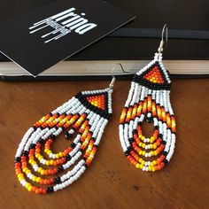 #irinahaluschak #indianearrings #indianjewelry #earrings #beadedearrings #seedbeadearrings #tribalearrings #tribaljewelry #boho #bihemian #bohojewelry #etsy #etsyshop #shopetsy #etsyjewelry #etsyearrings #nativeamerican #nativeearrings #nativeamericanjewelry #whitebeadedearrings #chandelierearrings #fringeearrings #dangleearrings #tasselearrings #fireearrings #fire #redesrrings #orangeearrings #yellowearrings #giftforher Traditional Teardrop Beaded Earrings With Large Beads, Traditional Teardrop Earrings With Tiny Beads, Traditional Large Bead Drop Earrings, Traditional Teardrop Beaded Earrings With Tiny Beads, Traditional Large Beaded Drop Earrings, Bohemian Polished Bead Drop Earrings, Traditional Dangle Beaded Earrings With Polished Beads, Artisan Beaded Drop Earrings With Large Beads, Artisan Large Beads Drop Earrings