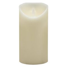 a white candle is lit on a white background