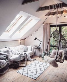 a living room with a hammock hanging from the ceiling