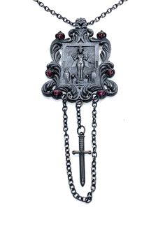 This Shrine necklace is cast in bronze, hand textured, oxidized and set with garnets. This piece is made to order and can take from 2-3 weeks to complete. Gothic Bronze Jewelry With Antique Finish, Gothic Metal Necklace With Antique Finish, Gothic Metal Jewelry With Antique Finish, Hand Forged Pendant Necklace For Ceremonial Occasions, Gothic Bronze Engraved Jewelry, Gothic Collectible Pendant Jewelry, Gothic Engraved Bronze Jewelry, Collectible Gothic Pendant Jewelry, Gothic Pendant Necklace With Antique Finish