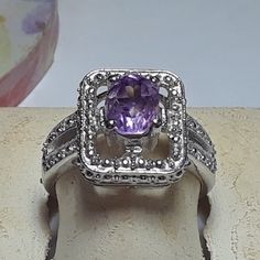 This Pretty Ring Features A Center 8x6mm Oval Amethyst, Set With 4 Sterling Prongs In The Center Of A Open Rectangular Halo. On One End Of The Frame There Is 1 Natural Small Round Diamond, Also Prong Set. The Rectangular Center Measures Aprox 9/16" X 7/16" And The Ring Weighs Aprox 5.049 Grams Of Solid (Stamped 925 Inside The Shank) Sterling Silver. This Pretty Amethyst & Diamond Ring Has A Msrp Of $499.00. Finger Size 8 (This Ring Can Be Sized By Your Local Jeweler, At Your Cost, We Do Not Size Classic Silver Amethyst Ring With Gemstone Accents, Fine Jewelry Amethyst Ring With Accent Stones In Silver, Fine Jewelry Silver Amethyst Ring With Accent Stones, Silver Amethyst Ring With Accent Stones For Formal Occasions, Silver Amethyst Ring With Gemstone Accents For Anniversary, Silver Amethyst Ring With Accent Stones, Classic Silver Rings With Gemstone Accents, Oval Amethyst Ring With Gemstone Accents In Sterling Silver, Oval Amethyst Ring In Silver