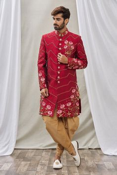 Maroon sherwani with floral embroidery and mandarin collar. Paired with peshawari pant.
Component: 2
Pattern: Embroidered
Type Of Work: Floral
Neckline: Mandarin
Sleeve Type: Full Sleeves
Fabric: Art Banarasi Silk, Dupion Art Silk
Color: Maroon
Other Details: 
Floral embroidery
Front buttons
Occasion: Wedding - Aza Fashions Traditional Anarkali Set With Naqshi And Traditional Drape, Traditional Festive Churidar With Naqshi, Festive Designer Bandhgala With Dabka Work, Festive Bandhgala With Resham Embroidery For Eid, Festive Naqshi Churidar For Festivals, Festive Bandhgala With Intricate Embroidery For Eid, Eid Festive Bandhgala With Intricate Embroidery, Festive Eid Bandhgala With Intricate Embroidery, Traditional Red Salwar Kameez With Naqshi