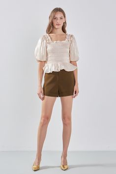 Feminine and timeless, this smocked top from endless rose will become a go-to in your wardrobe. With its fitted silhouette, square neckline, blouson short sleeves and elastic ruffled shoulders, it's designed to flatter. The smocking adds texture and depth to the piece while shirring at the peplum adds movement. For a timeless look, pair with classic denim or a floaty skirt, ideal for everything from casual days out to nights on the town. Fitted Square neckline Blouson short sleeves Smocking bodi Summer Puff Sleeve Top With Ruffles And Square Neck, Chic Puff Sleeve Top With Smocked Bodice, Chic Smocked Square Neck Top With Ruched Detail, Chic Smocked Top With Ruched Square Neck, Puff Sleeve Top With Smocked Bodice For Day Out, Square Neck Puff Sleeve Top With Ruffles For Brunch, Puff Sleeve Smocked Top With Ruffles For Day Out, Trendy Short Sleeve Puff Top With Smocked Bodice, Fitted Ruched Smocked Top With Ruffle Sleeves