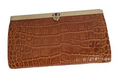 Patricia Nash Cauchy Croco Embossed Leather Frame Wallet-Cognac-NWT-Orig. Price $119.00                          NEW HAS ORIGINAL TAG Color : Cognac Croco Size/Profile: Bi-fold, rectangular wallet Walls: Genuine leather deep-embossed grape leaf logo Hardware: antiqued metal Construction: Heavy stitching Closure: Metal frame top with push lock Lining: Leather interior with nylon lining Interior: Zipper pocket, 4 bill slip pockets and 10 credit card slots RFID protection Size & Content Measurements: Approx. 7.5"L x 1.125"W x 4.375"H Shell: 100% leather Luxury Brown Bifold Clutch, Elegant Brown Clutch With Coin Pocket, Brown Textured Leather Clutch For Formal Occasions, Elegant Brown Textured Leather Wallet, Formal Brown Textured Leather Clutch, Brown Clutch Wallet For Formal Occasions, Brown Bifold Clutch For Formal Occasions, Formal Brown Clutch Wallet, Leather Frame