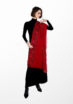 Crafted from a premium blend cashmere , this red scarf offers the perfect fusion of warmth and luxury. A vibrant masterpiece adorned with exquisite floral Gara embroidery and filigree lace panels on the long borders. The dual-colored black and red floral embroidery brings an elegant touch, reminiscent of nature's beauty, while the floral filigree lace enhances the scarf's delicate charm. The deep red color exudes a sense of passion making this scarf suitable for various occasions. Whether you ch Elegant Festive Winter Shawl, Elegant Winter Festive Shawl, Elegant Winter Festive Pashmina Shawl, Red Embroidered Shawl Dupatta, Red Embroidered Dupatta Shawl, Elegant Winter Shawl With Traditional Drape, Elegant Traditional Drape Winter Shawl, Elegant Traditional Winter Shawl, Elegant Winter Festive Dupatta