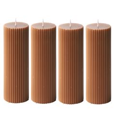 three brown candles sitting next to each other