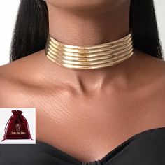 Statement leather choker, makes an impact with this irresistible leather embellishment with a gold motif line & adjustable leather closure. African jewellery with a glam ethnic touch. Product Details - Material: Acrylic and artificial leather - Our products are all nickel free and lead free  🚚 Free UK Delivery  🎁 Free Gift Packaging The Jarlia By Jolina collection consists of African Egyptian luxury jewellery. Jolina believes in the use of jewellery  to empower all women's beauty, allowing the African Choker, Gold Motif, African Jewellery, African Bracelets, Queen Jewelry, Leather Choker Necklace, African Earrings, Egyptian Jewelry, Statement Choker