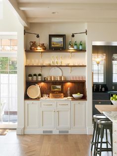 the kitchen is clean and ready to be used as a dining room or bar area