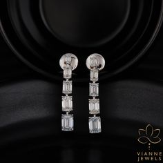 Experience unparalleled elegance with this intricately crafted earring set showcasing a combined weight of 5.31 total carats. Each earring features a pristine emerald cut lab-grown diamond, renowned for its elongated rectangular shape and stepped facets, which captures and reflects light spectacularly. Set in high-quality precious metal, these earrings are a testament to sustainable luxury and modern craftsmanship. Their exceptional clarity, coupled with a remarkable cut, ensures a shimmering display of brilliance and fire from every angle. Perfect for those special occasions or as an exquisite daily accessory, this pair promises a timeless appeal and a lasting impression. By choosing lab-grown diamonds, you're also making a conscious decision to support ethical and environmentally friendl Anniversary Wedding Gifts, 19 Days, Hand Crafted Jewelry, Crafted Jewelry, Anniversary Wedding, Precious Metal, Last Minute Gifts, Memorable Gifts, Emerald Cut