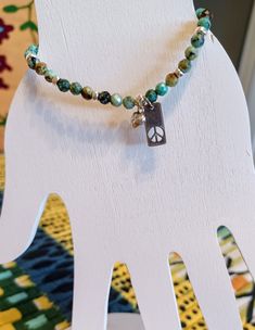 African Turquoise bracelet with sterling silver spacers and a sterling silver peace sign with a silver heart charm on high quality stretch for ease to slip on and go! Thanks for stopping by my Etsy store! African Turquoise Bracelet, African Turquoise, Heart On, Peace Sign, Silver Heart, Heart Charm, Turquoise Bracelet, Etsy Store, Beaded Bracelets