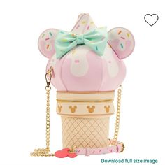 a pink ice cream cone with a bow on it's head and a chain around the neck