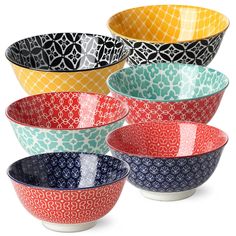 four bowls with different designs on them