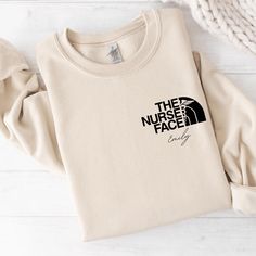 The Nurse Face Sweatshirt, Nursing School Grad Hoodie, Nicu Nurse, Nurse Sweatshirt, Nurse Life Tshirt, Registered Nurse Sweatshirt SWEATSHIRT INFO: ☁️ 50% cotton, 50% polyester 🎉 Medium-heavy fabric (8.0 oz/yd² (271.25 g/m ✅ Loose fit 🧶 Sewn-in label 👌 Runs true to size DESIGN INFO: ▪️ Design is being implemented as DTF Technologies ▪️ There may at times be a slight difference between real and perceived colors of an item due to the nature of an item or resolution of a screen. CARE INSTRUCTIONS: ▪️ Wash inside out in cold water ▪️ Hang dry or dry on low heat, hang dry is preferred ▪️ NO dry cleaning ▪️ Iron inside out on low heat if needed SHIPPING INFO: 1-3 Business Days. Please Double check your address. We are not responsible for items going to the wrong address. If you entered the w Fleece T-shirt With Letter Print, Fleece T-shirt With Letter Print And Crew Neck, Letter Print Fleece T-shirt Crew Neck, Crew Neck Fleece T-shirt With Letter Print, Fleece Tops With Letter Print And Crew Neck, Fleece Crew Neck Top With Letter Print, Casual Crew Neck Hoodie With Name Print, Casual Crew Sweatshirt With Name Print, Casual Crew Neck Sweater With Name Print