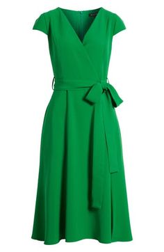 A vivid verdant hue and a graceful neckline define a work-to-weekend dress secured with a simple sash. 44" length Hidden back-zip closure Surplice V-neck Short sleeves Removable sash Lined 100% polyamide Dry clean Made in the USA of imported fabric Green Formal Dress With Surplice Neckline, Formal Green Dress With Surplice Neckline, Fitted Green Belted Dress, Elegant Fitted Kelly Green Dress, Elegant Kelly Green Fitted Dresses, Elegant Kelly Green Dresses For Spring, Elegant Kelly Green Spring Dresses, Elegant Green Belted Dress For Work, Chic Green Belted Dress