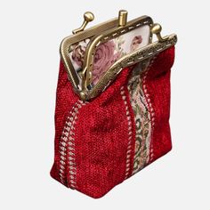 With a nod to the Victorian era, MCW’s freshly combines the classic and elegant design of the traditional carpet bag with a textural and tactile twist.The main body of coin purse is made with rich chenille carpet, cotton floral canvas, and brass clasp with double kiss lock.There are pockets for ID and cards on both side of middle panel, which makes this coin purse very functional and easy to organize your ID, cards, money and coins. This Victorian Carpet Coin Purse is going to be your daily comp Red Formal Bag With Card Slots, Elegant Shoulder Bag With Card Slots As Gift, Elegant Shoulder Bag With Card Slots For Gift, Vintage Red Rectangular Clutch, Vintage Pouch Bag With Card Slots, Red Vintage Clutch For Daily Use, Gift Clutch Bag With Coin Pocket, Red Clutch Coin Purse For Formal Occasions, Vintage Handmade Red Coin Purse