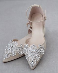 a pair of wedding shoes with crystal embellishments