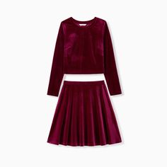 Elegant and comfortable, this red velvet co-ord set includes a long-sleeved crop top and pleated skirt. Perfect for moms and their mini me's, the set is ideal for everyday wear, vacations, and gatherings.
* Please add each size separately to your shopping cart
* Piece of product: Each size includes a co-ord set (1 top and 1 skirt)  
* Product features: long-sleeved crop top and pleated skirt
* Fabric characteristics: soft, breathable, and comfortable 
* Neckline: round neck 
* Sleeves: long sleeves 
* Style: everyday casual, elegant 
* Fit: moderate 
* Length: above knee length 
* Source of goods: imported 
* Supplier: PatPat Skirt Fabric, Sleeves Style, Skirt Co Ord, Co Ord Set, Co Ord, Matching Outfits, Above Knee, Mommy And Me, Long Sleeve Crop Top