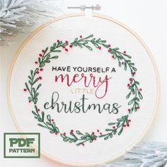 a cross stitch christmas wreath with the words have yourself a merry little christmas