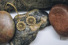 "Beautiful gold chrysanthemum dangle earrings, a simple but elegant look for any outfit! The brass ear wires measure 1 3/10\" x 9/10\", and the gold chrysanthemums measure 3/4\" x 3/5\" (Total length is approximately 2\") All items are lead and nickel free, message with any questions, thanks!" Everyday Gold Flower Charm Earrings, Brass Drop Earrings With Flower Charm, Gold Brass Earrings With Flower Charm, Elegant Everyday Flower Earrings With Ear Wire, Gold Earrings With Flower Charm For Everyday, Everyday Gold Earrings With Flower Charm, Delicate Gold Brass Flower Earrings, Delicate Gold Flower Pendant Earrings, Delicate Gold Flower Earrings For Everyday