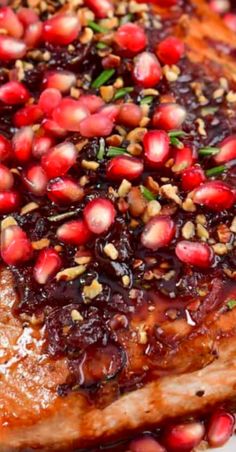 meat with pomegranates and spices on it