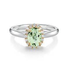 an oval green stone surrounded by white and yellow diamonds