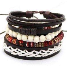 This nomadic lifestyle inspired piece is crafted with an eclectic mix of genuine leather, hand-strung beads and rich red woven cotton. Fully adjustable, this set of four bracelets can be worn all together, or mixed and matched. Worldwide Shipping Please allow 2-5 days for delivery 1081 Black Bohemian Leather Bracelet, Brown Bohemian Braided Bracelet, Brown Bohemian Braided Bracelets, Bohemian Black Braided Bracelets, Multicolor Bohemian Leather Bracelet, Brown Braided Leather Bracelet In Bohemian Style, Black Beaded Bohemian Leather Bracelet, Bohemian Braided Leather Bracelet Gift, Multicolor Leather Bracelet In Bohemian Style