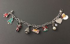 Beautiful 925 Sterling Silver Holly Christmas Charms Bracelet. Good condition, Stamped "925" mark on clasp and charms. Featuring 9 different Holly Christmas charms design, this bracelet is the perfect example of authentic. Size: 7 1/4" (18.42 cm) long with lobster clasp. Weight: 39 grams (1.25 troy oz)  Please read description carefully. We have no return and exchange policy . Ask for help if you have questions. Holly Christmas, Charms Bracelet, Christmas Charms, Silver Charm Bracelet, Christmas Holly, Ask For Help, Last Minute Gifts, Chain Link Bracelet, Silver Charms