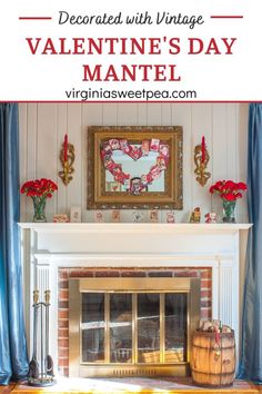 a fireplace with blue curtains and red flowers in the corner, on top of a mantel