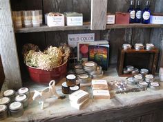 an assortment of candles and other items on a table