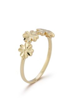 A cluster of flowers enhance a band ring shaped from warm 14-karat gold. 14k gold Made in Turkey Yellow Gold Flower Ring Stamped 14k, Formal Yellow Gold Flower Ring, 14k Gold Flower Cluster Ring For Anniversary, 14k Yellow Gold Flower Ring, 14k Gold Formal Flower Ring, Formal 14k Gold Flower Ring, Yellow Gold Flower Cluster Ring As Promise Ring, 14k Gold Flower Shaped Rings, Formal 14k Gold Flower Cluster Ring