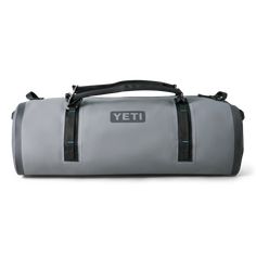 a grey duffel bag with the word yeti on it's front side