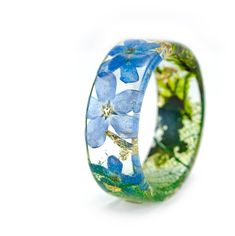 Forest ring "forget-me-not" Materials: Resin, Forget-Me-Not Flowers , Forest moss ,Gold 24K Forget-me-not symbolizes true love and memories that last forever Custom orders are welcome. Every item comes in a beautiful, individual original box ready for gift giving. Natural VyTvir rings are made with great love for nature If you have any questions please contact me. All rings are resin: https://www.etsy.com/ru/shop/VyTvir?ref=l2-shopheader-name§ion_id=17463694 All rings are made of wood and resin: Blue Nature-inspired Ring For Gift, Handmade Flower Ring For Promise, Handmade Promise Flower Ring, Handmade Blue Flower Ring For Anniversary, Forest Ring, Forest Moss, Ring Gifts, Resin Ring, Forget Me Not