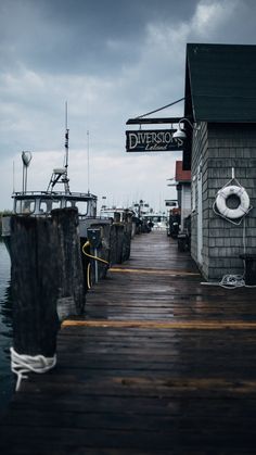 a dock with boats docked in the water