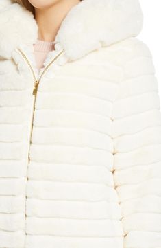 Pop some plush into the snowy season in this fabulous faux fur jacket fixed with a cozy hood. Lined 100% polyester faux fur Dry clean Imported Faux Fur Coat With Zipper For Cold Weather, Hooded Faux Fur Outerwear In Winter White, Chic Hooded Fur Coat With Faux Fur Trim, Winter White Faux Fur Coat For Cold Weather, Hooded Faux Fur Coat With Trim, Hooded Faux, Faux Fur Jacket, Fur Jacket, Black Cream