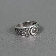 SKU: tyt_98b Features: Brand new sterling ring silver 925. Not plated, 100% solid silver metal! Approx weight of the product depends on the size 4,2 g.; Processing - blackening by oxidation; Availability of proprietary tag manufacturer - Yes; Country of origin - Ukraine; www.indigo.jewelry Symbolic Silver Moon-shaped Ring, Silver Moon Shaped Symbolic Ring, Silver Moon-shaped Symbolic Ring, Celestial Silver Rings Stamped 925, Symbolic Silver Star-shaped Ring, Celestial Silver Crescent Ring, Celestial Crescent Silver Ring, Indigo Jewelry, Islam Symbol