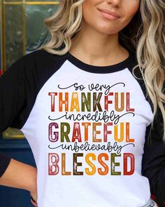 a woman wearing a black and white shirt with the words grateful on it