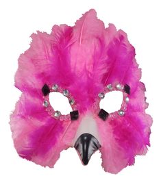 a pink mask with feathers and beads on it