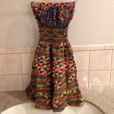 Brand New, Never Worn, No Tags. Custom Ordered And Handmade Dress From Ghana, Purchased While On A Trip. Very Colorful And Festive. Skirt Is Great For Twirling Around. Entire Length Of Dress Between 35-36 Inches Long. Because Of Smoked Material, Can Fit Xs-M. Casual Multicolor Knee-length Sundress, Casual Strapless Bandeau Dress With Smocked Back, Sundress With Smocked Bodice And Bandeau Shape, Summer Multicolor Sundress With Smocked Back, Bandeau Sundress With Smocked Bodice, Strapless Sundress With Smocked Back, Fitted Strapless Smocked Dress For Vacation, Multicolor Smocked Bodice Dress For Spring, Multicolor Smocked Back Dress For Summer