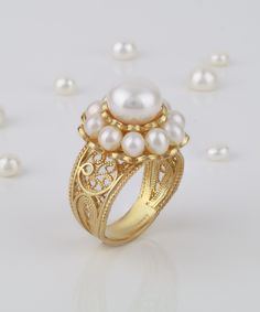 "Pearl 18k Gold Plated Silver Cocktail Ring,18k Gold Plated Sterling Silver Artisan Crafted Natural Pearl Round Statement Ring, Valentine Jewelry Gift Boxed for Her Ring Face : 0.80\" round 4-5 mm Pearls surround Center 10 mm Round pearl for a feminine artistic look. This will come in a designer pouch, put in gift box and a romance card. Free shipping Made in an artisan workshop by an artist with 20+ Years experience. This a very Victorian, Artistic Ring that has sold out many times in England, 22 Carat Gold Jewellery, Valentine Gifts Jewelry, Silver Cocktail, Fine Silver Jewelry, Evil Eye Pendant, Natural Pearl, Valentines Jewelry, Artisan Craft, Perfect Gift For Her