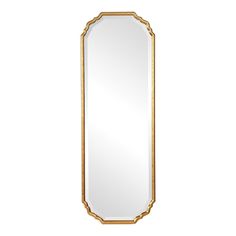 a gold framed mirror on a white wall