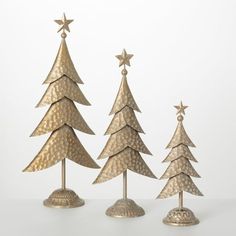 three metal christmas trees on top of each other