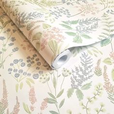 an image of a floral wallpaper pattern on a bed sheet that has been rolled up