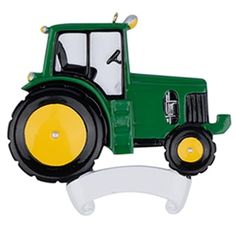 a green tractor shaped ornament on a white background