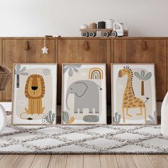 three children's wall art prints with animals and giraffes on them