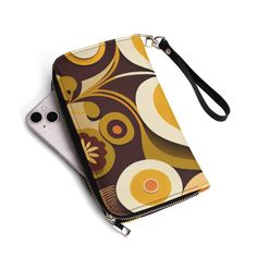 This retro wallet is the grooviest way to store your cash and cards! Featuring a funky flower power design, this wallet is sure to make a statement. With a spacious interior and durable leather construction, it's both stylish and practical. Get your groove on with this wallet today! Exquisitely crafted for the modern sophisticate. It boasts ample space for your phone, cash, and cards. Available in sleek black and sophisticated white interiors with a handy carrying strap. Lightweight and snug, th Power Design, White Interiors, Continental Wallet, Flower Power, Leather Wallet, The Modern, Sleek, Wallet, Leather