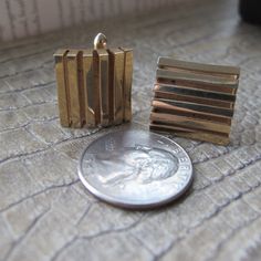 1960's Gold SWANK Fashion Cufflinks, Modernist Shape, In a Swank Vintage Hardcase Box. Men's Gold Tone Affordable Cuff Links, Cufflinks. Condition is overall good, the inside panel needs cleaning, fyi. Sold slightly imperfect. Zoom in, please. 3/4 IN Signed Swank Ideal size Gold Tone Fashion Cufflinks Vintage 1965 to 1975 time window approx More #MensJewelry #MensFashion : https://www.etsy.com/shop/MaisonettedeMadness?ref=hdr_shop_menu&section_id=22164745 Vintage Cufflinks, Mens Gold, Beauty Items, Wood Jewellery, Artisan Craft, Cuff Links, Photo Jewelry, Makers Mark, Little Gifts