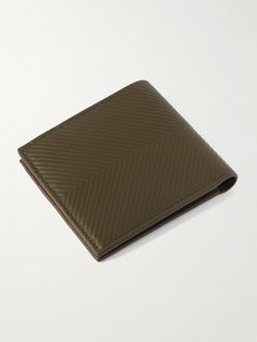 Loewe's billfold wallet has been crafted in Spain from leather that's embossed to create a herringbone texture. It's printed with a silver logo at the front and opens to a pair of bill sleeves and eight card slots. Formal Bifold Wallet With Engraved Logo, Luxury Leather Embossed Wallets, Luxury Embossed Leather Wallet, Modern Leather Wallets With Engraved Logo, Classic Embossed Wallets For Formal Occasions, Formal Bifold Wallet With Embossed Details, Classic Embossed Bifold Wallets, Classic Embossed Leather Wallet, Loewe Logo